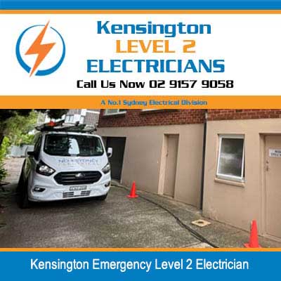 Emergency level 2 electrician van parked at residential property with safety cones in Kensington